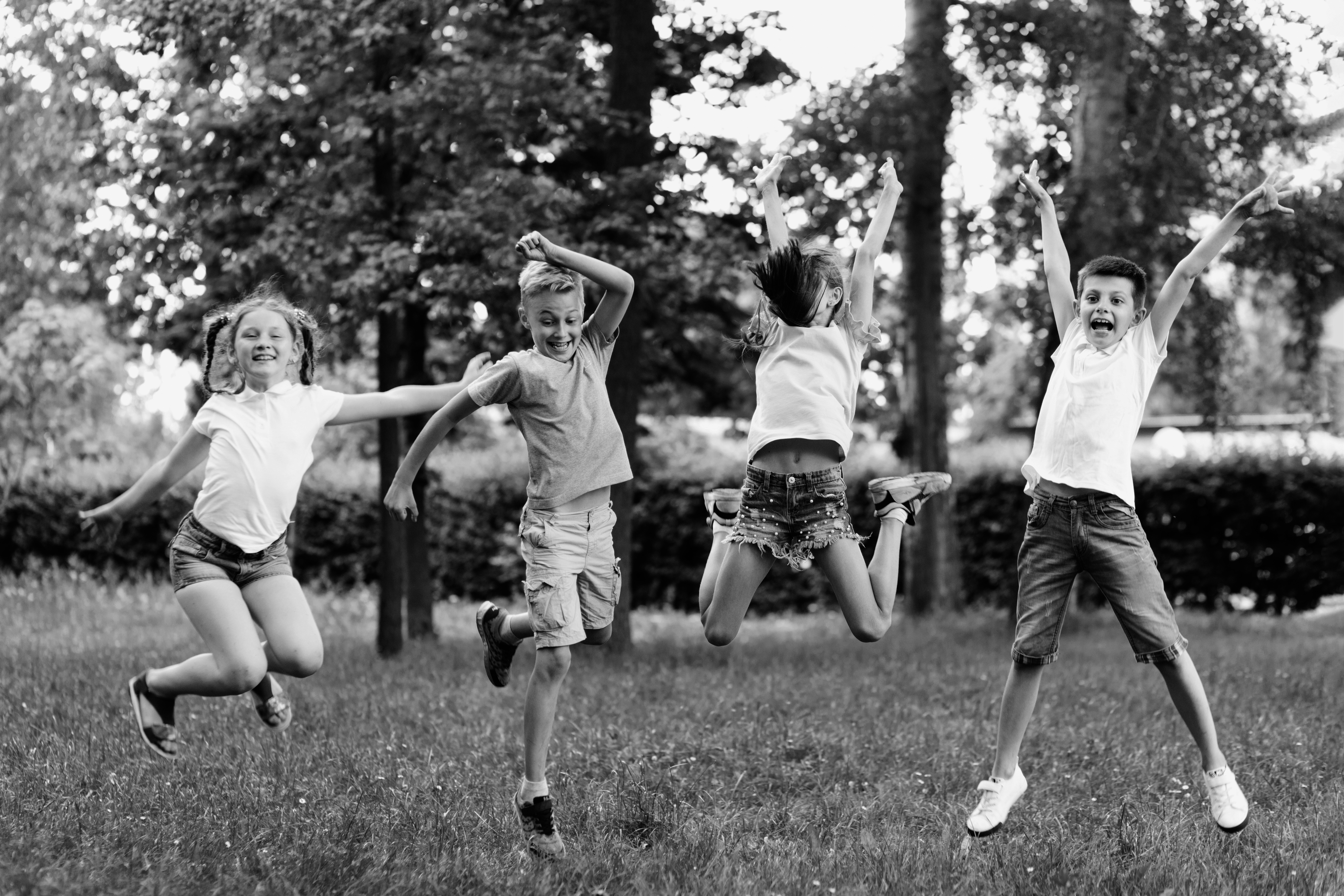 long-shot-kids-jumping-together
